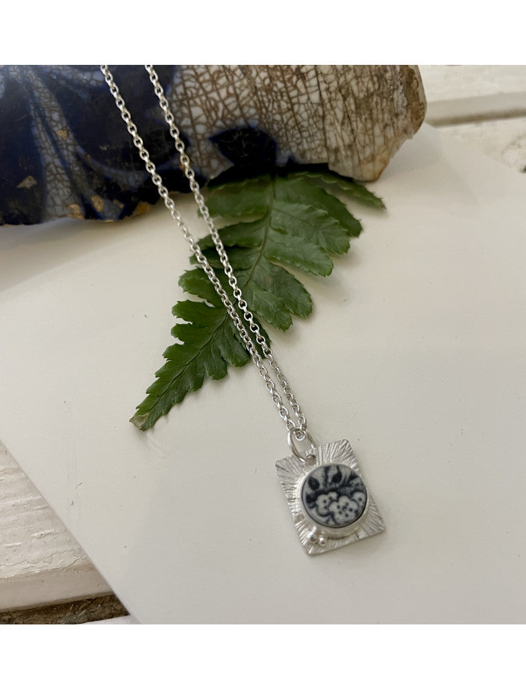 Unearthed Black & White Blossoms Pendant Necklace