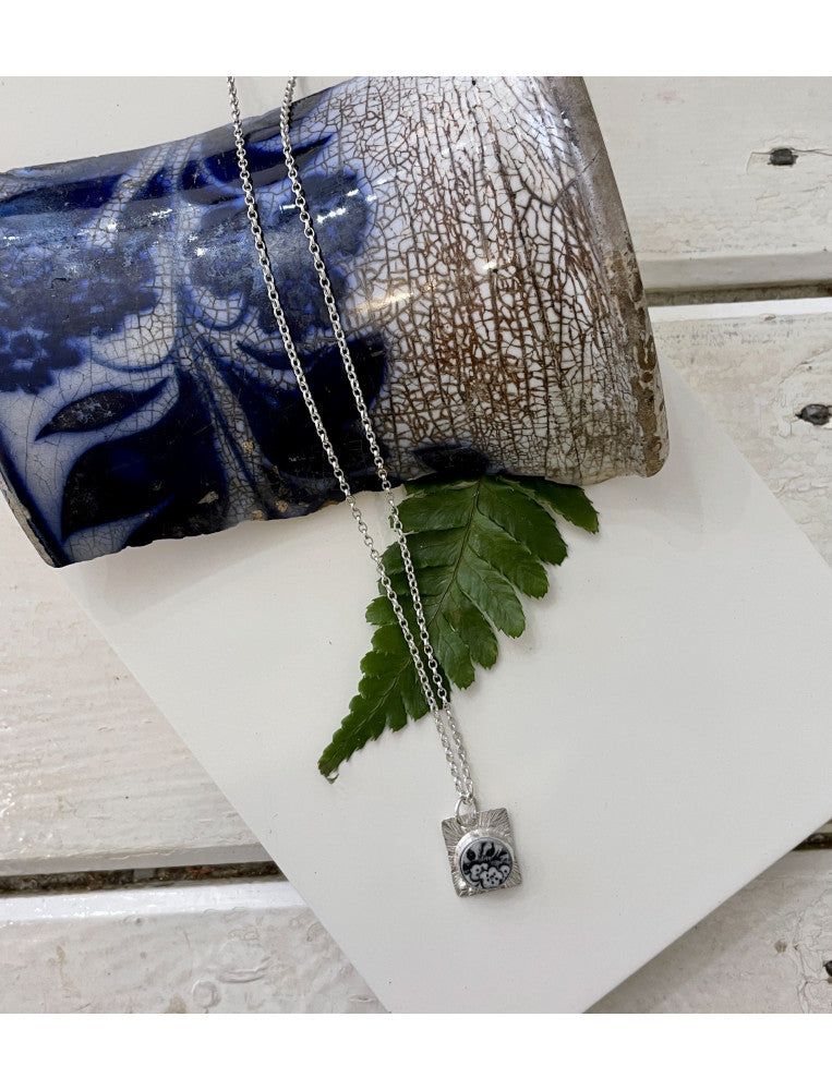 Unearthed Black & White Blossoms Pendant Necklace